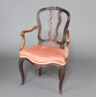 A 19th Century  French carved walnut open arm chair, the seat of serpentine outline, raised on cabriole supports 92cm h x 55cm w x 41cm d (seat 28cm x 26cm) 