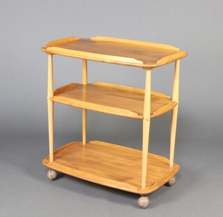 Ercol, a mid-Century light elm and beech rectangular 3 tier tea trolley 75cm h x 72cm w x 46cm d 