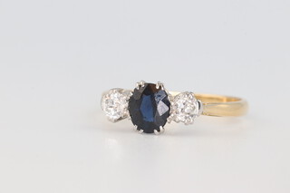 A yellow metal 18ct sapphire and diamond ring, the centre stone approx. 0.75ct, the 2 diamonds each approx. 0.20ct, size P, 2.8 grams 