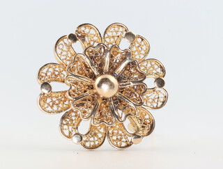 A yellow metal floral filigree brooch 10.5 grams 