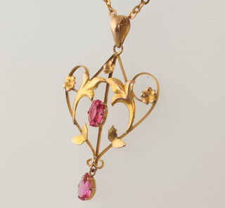 An Edwardian 9ct garnet pendant on a ditto 50cm chain, gross weight 4.4 grams 