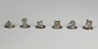 A good set of 6 novelty silver menu holders in the form of an owl, fox, cockerel, horse, dog and duck on circular bases, Birmingham 1949, maker G & CH 239 grams 