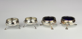 A pair of George IV silver table salts London 1825, another pair with rubbed marks, 238 grams 