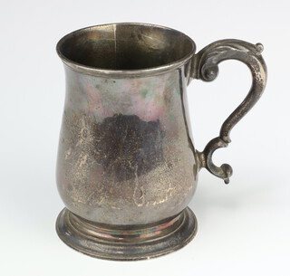 A George III silver baluster mug with S scroll decoration and later inscription London 1763, maker Fuller White, 421 grams 13cm 