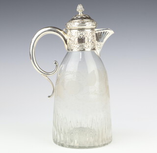 A silver mounted cut glass claret jug with scrolling leaf decoration, the repousse silver lid with S scroll handle, London 1897, Elkington & Co., 25.2cm 