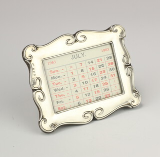 An Edwardian silver desk top calendar with scroll frame Birmingham 1908 12cm x 10cm 