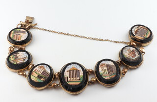 A 19th Century gilt metal mounted Italian micro mosaic bracelet containing 7 Roman architectural views 