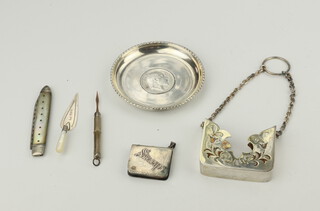 A Victorian silver mounted mother of pearl trowel book mark, fruit knife, dish, stamp box, tooth pick, holder