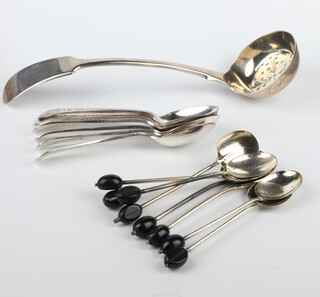 A Victorian silver sifter spoon, Sheffield 1864 and minor tea and coffee spoons, 171 grams gross 