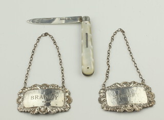 A Victorian mother of pearl and silver fruit knife Sheffield 1892, 2 silver spirit labels London 1974 