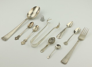 A Continental 800 standard miniature sifter spoon and minor flatware, gross weight 170 grams