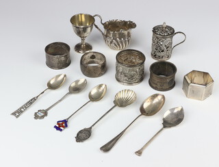 An Edwardian silver cream jug with demi-fluted decoration Birmingham 1904, 3 napkin rings and minor items, 287 grams 