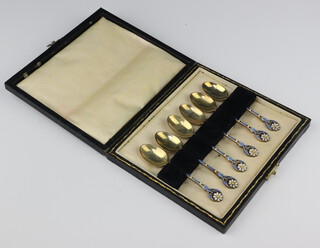 A set of 6 silver gilt and guilloche enamel coffee spoons decorated with flower heads Birmingham 1922, 59.5 grams, cased