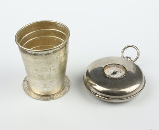 A novelty white metal compass in the form of a pocket watch enclosing a travelling retractable beaker, patent no.15061 