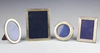 A round rectangular silver photograph frame, Sheffield 1994 15cm x 11cm, 3 others