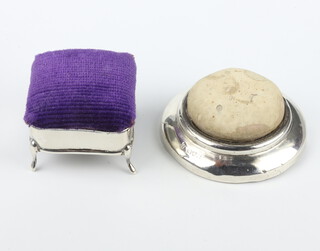 An Edwardian circular silver pin cushion  7cm, an Edwardian square trinket box with pin cushion lid  5cm, both with rubbed marks