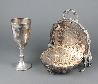 An Edwardian silver plated biscuit box with shell shape cover and folding base with pierced decoration 25cm together with a Victorian plated goblet