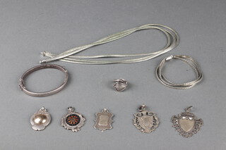 Five silver sports fobs, a silver necklace, 2 bracelets and a ring 141 grams 