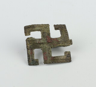 A Roman style metal 4 arm brooch with pin 