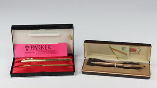 A Sheaffer gold plated fountain pen with 14ct nib, a Parker gilt ballpoint pen and a gilt Cross propelling pencil 