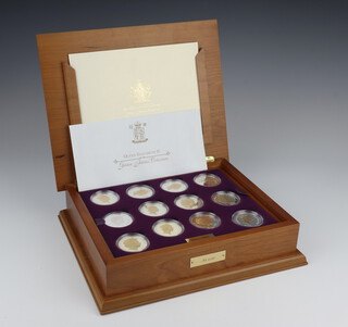 A set of 24 Queen Elizabeth II Golden Jubilee commemorative crown, each 28 grams, contained in a fitted wooden collectors chest  