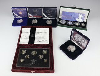 A 1997 United Kingdom Silver Anniversary Collection proof coin set no.4783 of 15000, 48.43 grams together with a 2001 silver proof Britannia Collection 59.9 grams and 4 proof silver 5 pound coins each 28 grams 