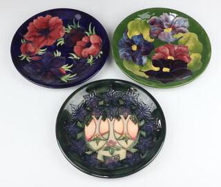 A Moorcroft plate decorated "Clematis" designed by Walter Moorcroft, signature and impressed mark 26cm, ditto  "Anemone" 26cm and 1 other plate decorated "Cluny" designed by Sally Tuffin, impressed marks 26cm