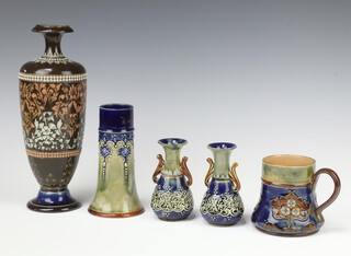 A Royal Doulton jug decorated with stylised flowers 8cm, pair of 2 handled vases with geometric decoration 10cm, ditto vase decorated with flower heads 14cm and a brown ground oviform vase decorated with formal flowers 25cm 