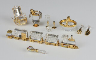 A Swarovski Crystal  Classics locomotive, tender and 3 pieces of rolling stock, a rocking chair, drinking set, magnifying glass, basket and tools