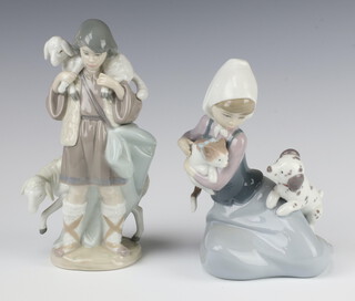 A Lladro group of a girl with kitten and puppy 5062 17cm, ditto shepherd 5435 20cm, boxed 