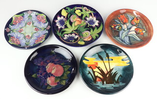 Five Moorcroft plates comprising "Florian Lilac" designed by Emma Bossons, dated 2005, monogrammed VF 26cm, "Queens Choice" deigned by Emma Bossons, impressed marks 28cm (second),  "Tulips" designed by Sally Tuffin, impressed marks 26cm, "Finches" designed by Sally Tuffin, 26cm, "Reeds at Sunset", designed by Philip Richardson, with impressed marks 26cm