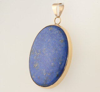 A 9ct yellow gold mounted oval lapis lazuli pendant 50mm, 16.4 grams gross