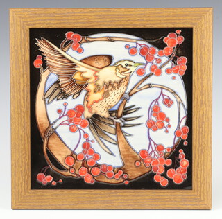 A Moorcroft square tile decorated with a bird amongst berries no.34/50 24cm 