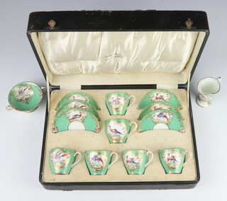 A Royal Doulton part coffee set, the turquoise ground with panels of exotic birds and flowers no.1321 and 1886 (1 cup and 1 saucer cracked) contained in a non original case, together with a matching jug and 2 handled bowl