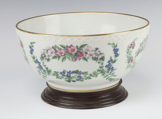 A Royal Copenhagen Flowers of Copenhagen bowl by B Johansen 1982 on a wooden stand 24.5cm 