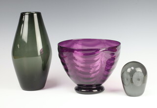 A Whitefriars shadow green glass tapered vase by Geoffrey Baxter, pattern number 9596 23cm, a Whitefriars amethyst  bowl by William Butler, pattern number 7170,14cm and a Whitefriars owl paperweight 9cm  