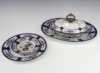 A 19th Century Imari pattern 55 piece ironstone dinner service comprising 5 large graduated meat plates (1 cracked), 2 shallow oval tureens and covers (1 with crack to base), an oval tureen base (cracked), 18 dinner plates (1 chipped, 12 cracked), 12 side plates (4 cracked), 14 tea plates (4 cracked, 1 chipped), oval sauce tureen (handle missing), 2 sauce tureen stands (cracked)