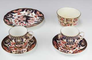 A 43 piece Royal Crown Derby Imari pattern tea service comprising 12 tea plates (1 cracked, 1 chipped), sugar bowl (cracked), 12 cups and 12 saucers (2 saucers with staple repair, 1 has a chip, 1 cup is cracked and chipped, 1 is cracked) 6 egg cups (1 with chip), all with Derby cypher to base, some marked 383 and impressed, together with a Davenport Imari patterned 3 piece condiment set (salt cracked, damage to top of pepper, mustard with minor chips to the base)