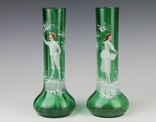 Two green glass Mary Gregory style vases decorated figures of standing girl and boy 25cm 