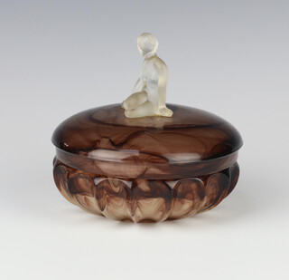 An Art Deco brown opaque glass circular powder bowl, the lid applied a naked figure of a seated lady 12cm 