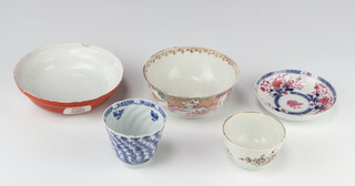 A 19th Century Chinese blue and white cup decorated with scrolling flowers 7cm (chipped) a floral tea bowl (cracked), a famille rose bowl (cracked), an Imari saucer (stuck) and a Japanese shallow bowl (chipped) 