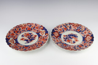 A 19th Century Imari scallop plate decorated with flowers 31cm, ditto 31cm 