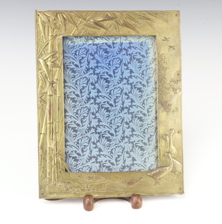 An early 20th Century soft metal repousse Japanese photograph frame decorated with geese, buildings and bamboo 32cm x 26cm 