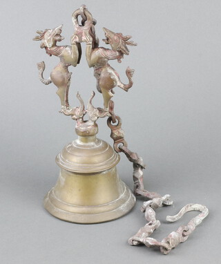 An Eastern gilt metal hanging bell surmounted by 2 figures of standing beasts 29cm 