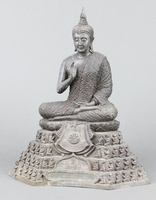 A cast bronze figure of a seated Buddha 28cm x 25cm 