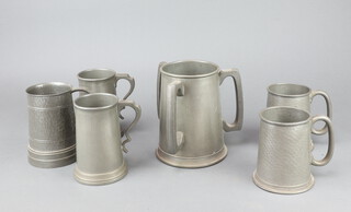 A 3 handled pewter loving cup with glass base 17cm, an English planished pint pewter tankard with glass base inset 3 dice, 2 James Dixon pewter tankards with glass bases marked 495 and a Reliable planished pewter tankard