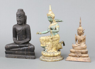 A carved wooden figure of a seated Buddha 25cm, a Thai gilt bronze figure of a kneeling Deity 27cm and 1 other 21cm  