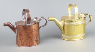 A Victorian oval brass hot water carrier 24cm h x 31cm w x 12cm d (some dents) and a copper ditto 