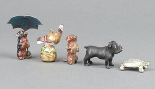 A painted metal figure of a Dachshund with an umbrella 5cm (some paint loss), standing dog 3cm, tortoise 3cm, dog 3cm and a porcelain figure of a bird 4cm (a/f)