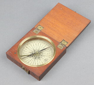 An 18/19th Century compass with paper dial contained in a wooden case 2cm x 8cm x 8cm 